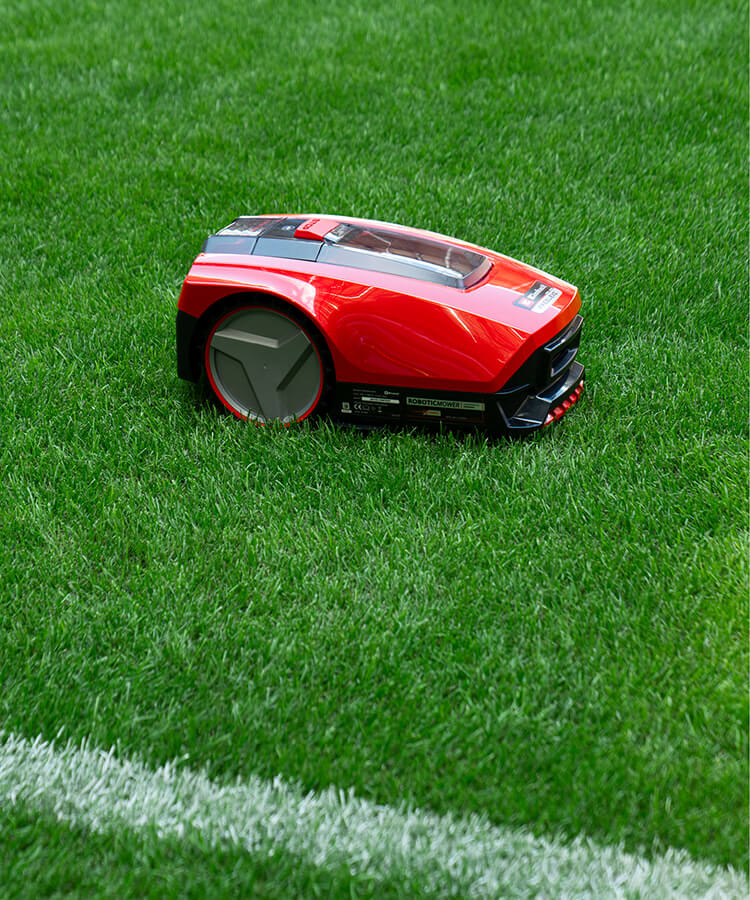 Einhell robotic lawn mower	on a soccer field